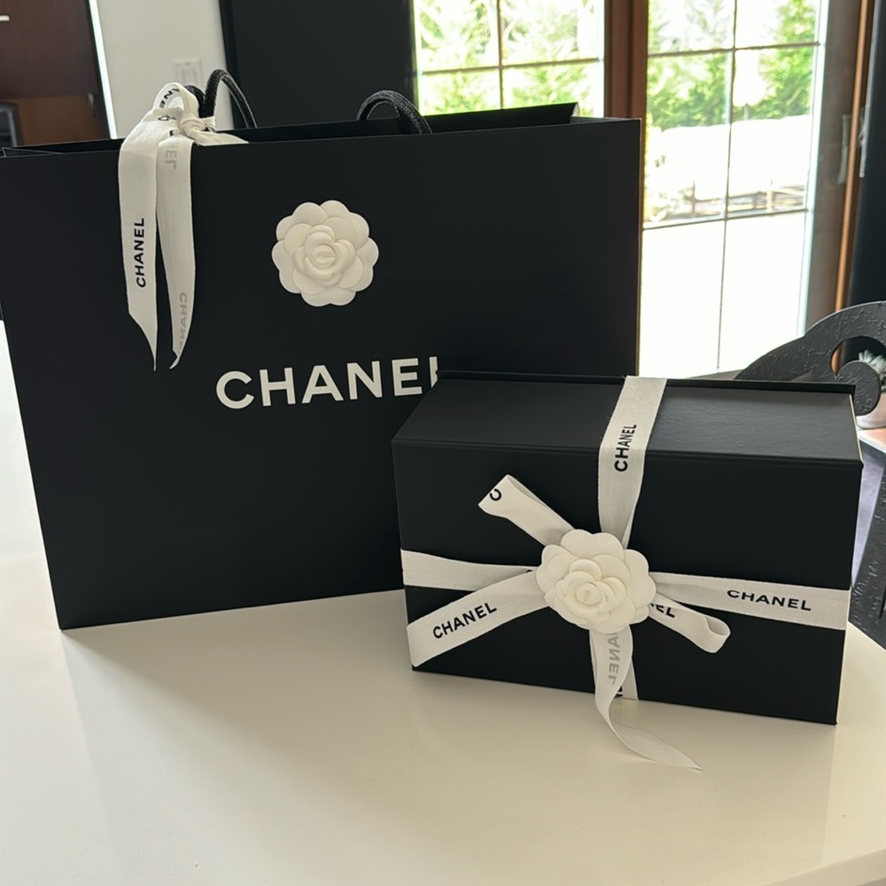 Chanel box, ribbon, signature bow and shopping bag